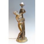 A circa 1900 lacquered brass figure of a robed maiden, standing upon an associated circular brass