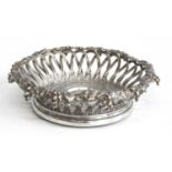 An early Victorian loaded silver wine coaster, having grape and vine applied rim above interlaced
