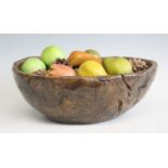 An 18th century elm bowl, being simply carved out and of good colour and patina, signed verso IPS.