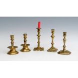 A pair of 18th century Heemskerk brass candlesticks, each having multi-knopped mid-drip stems and