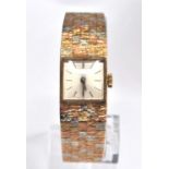 A 9ct rose, white and yellow gold lady's Bueche Girod manual wind wristwatch, having square cream