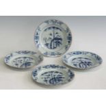 A set of four 18th century Chinese blue and white export porcelain plates, in the grape and squirrel