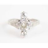 A white metal Art Deco style diamond three stone ring, comprising three graduated Old European cut