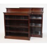 A pair of Edwardian mahogany open bookcases, each having raised backs with dentil moulded frieze