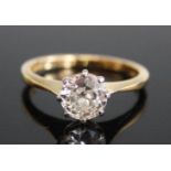 An 18ct yellow and white gold diamond single stone ring, featuring a round brilliant cut diamond