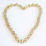 A 9ct yellow gold bead necklace by Champiesan, featuring 35 ribbed 9.3mm diameter beads