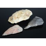 A large Mesolithic flint tool, 10 x 7cm, together with one other and a chert example. (3)