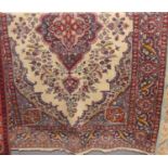 A Persian woollen cream ground Tabriz rug, 180 x 130cm