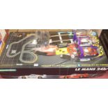 A boxed Scalextric Le Mans set and three boxed Scalextric cars to include 2x Ford Focus, and a