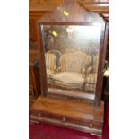 A 19th century mahogany swing dressing table mirror, raised on three drawer box base