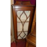An Edwardian mahogany and satinwood inlaid single door glazed corner cabinetH. 163cm, W. 60cm, D.