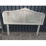 A contemporary French white painted and cane inset double headboard