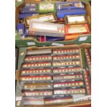 Two boxes containing a quantity of Hornby 00 railway carriages and a box of various Hornby and other