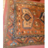 A Caucasian woollen brown ground rug, geometric floral decorated within trailing tramline borders,