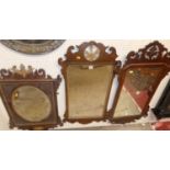 Three various late 19th century fret carved Chippendale style mahogany framed wall mirrors (each