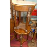 A pair of contemporary Empire style mahogany circular occasional tables, each with gilt metal bust