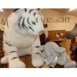 A plush soft-toy Siberian Tiger in seated pose; together with a Simply Soft Collection dog; and a