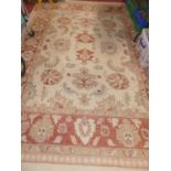 A Caucasian woollen cream ground rug, 210 x 221cm