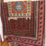 A Persian woollen blue ground Shiraz rug; together with a Persian woollen red ground Bokhara rug;