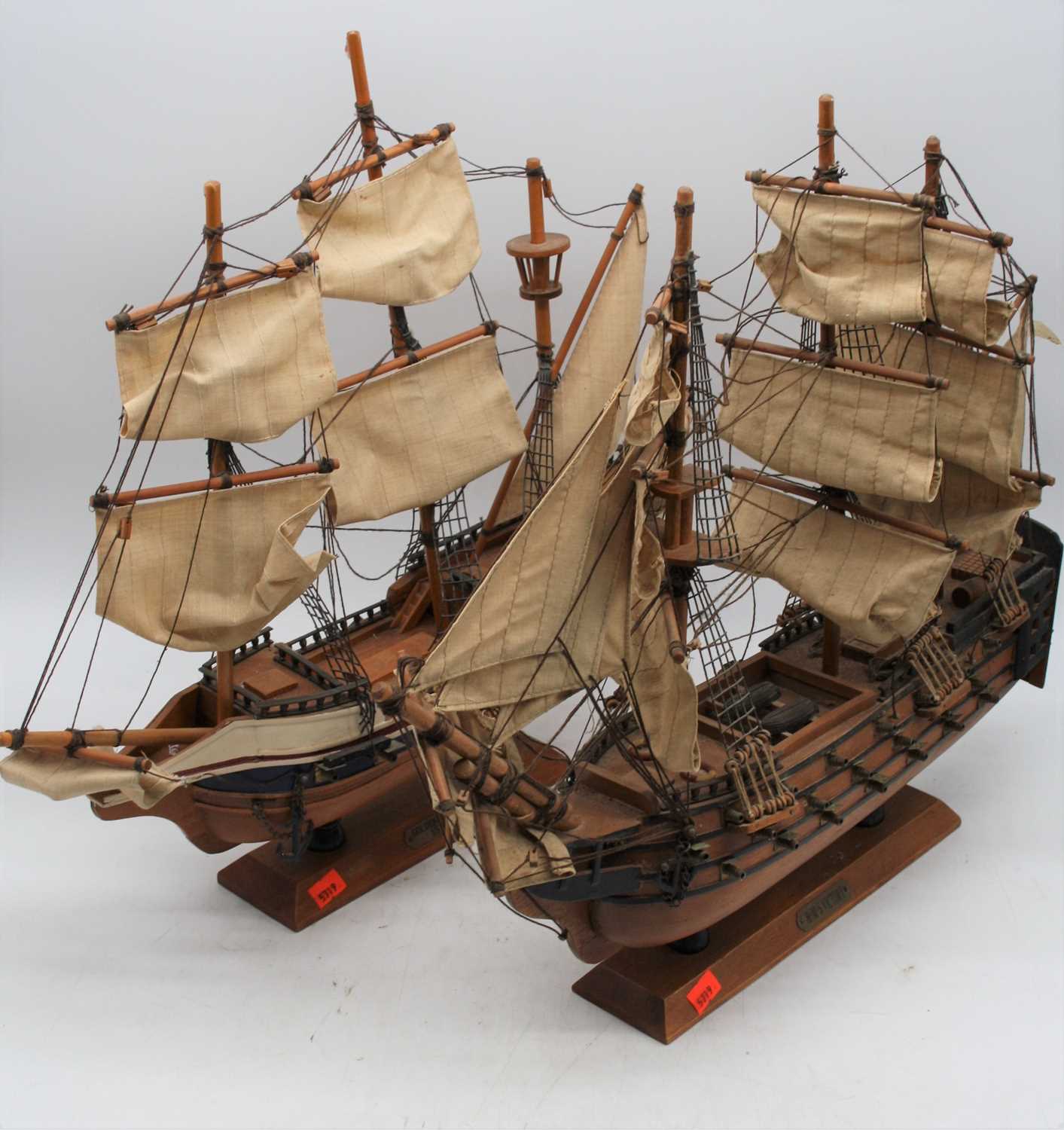 A wooden model of The Golden Hind, h.44cm; together with another similar of HMS Victory (2)