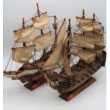 A wooden model of The Golden Hind, h.44cm; together with another similar of HMS Victory (2)