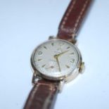 A lady's Cyma 9ct gold cased vintage manual wind wristwatch, having signed champagne dial and