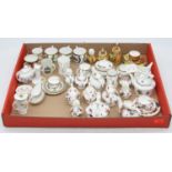 A collection of miniature tea wares to include Coalport Fallen Fruit pattern and Coalport Hong Kong