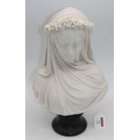 A resin head & shoulders bust of 'the veiled lady', mounted upon a socle base, height 35cmAppears