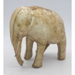 A vintage kid leather model of an elephant, h.20cmRight tusk is hanging off.Missing left ear.