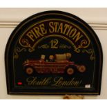 A reproduction relief sign inscribed "Fire Station 12 South London", height 53x60cm