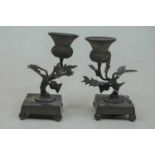 A pair of late 19th century brass table candlesticks, each sconce in the form of a thistle, on