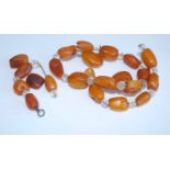 A rough cut butterscotch amber and crystal necklace (a/f), gross weight 26.9g