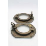 Two brass ships port holes, 31 x 25cm