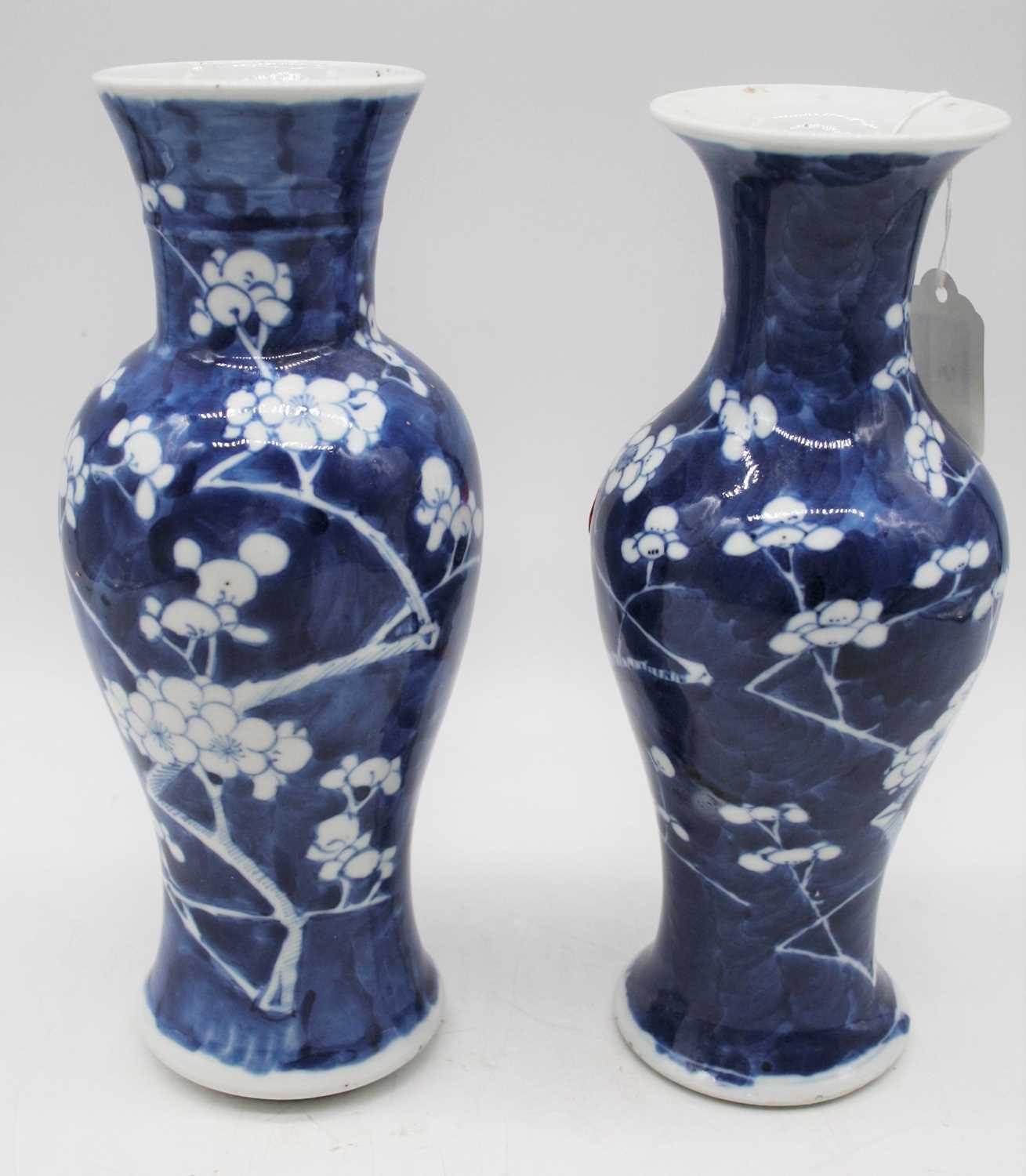 A near pair of Chinese export porcelain vases, each of baluster form, in the Prunus pattern,