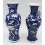 A near pair of Chinese export porcelain vases, each of baluster form, in the Prunus pattern,