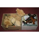 Two boxes containing a collection of miscellaneous items to include teddy bears and crucifixessee