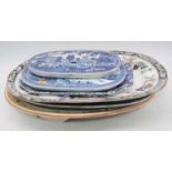 A 19th century blue and white Willow Pattern meat dish; together with three various other meat