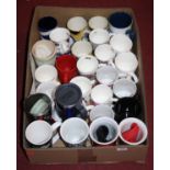 A box of vintage mugs