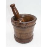 A turned sycamore pestle and mortar, the mortar h.17cm