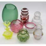 A collection of coloured glassware to include a Loetz style iridescent glass vase, height 12.