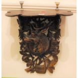 A Black Forest carved wall bracket, in the form of a stag amongst foliage, height 48cm