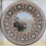 A Thoune earthenware plate, decorated with a mountain landscape, dia.21cm