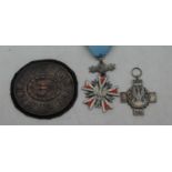 A post-WWII Polish felt backed arm badge; together with two Polish commemorative medals (3)