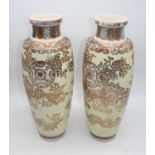 A pair of Japanese Satsuma earthenware vases, gilt decorated with flowers, h.47cm