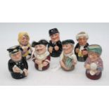 A collection of seven Royal Doulton figural Doultonville Collection series jugs, largest height