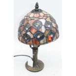 A 20th century Tiffany style table lamp, having coloured glass shade, h.35cm