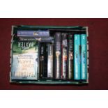 A box of Terry Pratchett volumes