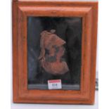 A 19th century wax head and shoulders portrait bust of a soldier, housed in a maple frame, bust 11 x