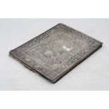 A late Victorian leather blotter, the white metal cover embossed with the word Punch above a