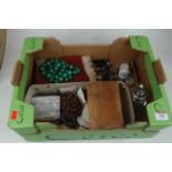 A box of miscellaneous items, to include silver topped dressing table jars, nut beads, beaded